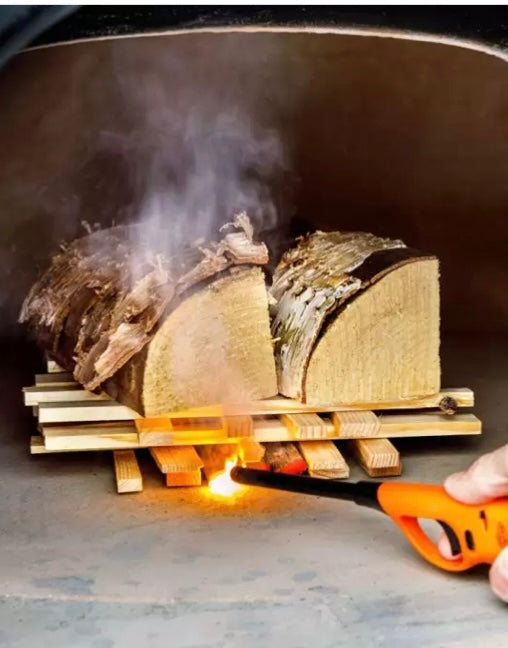 Curing a pizza oven before using.